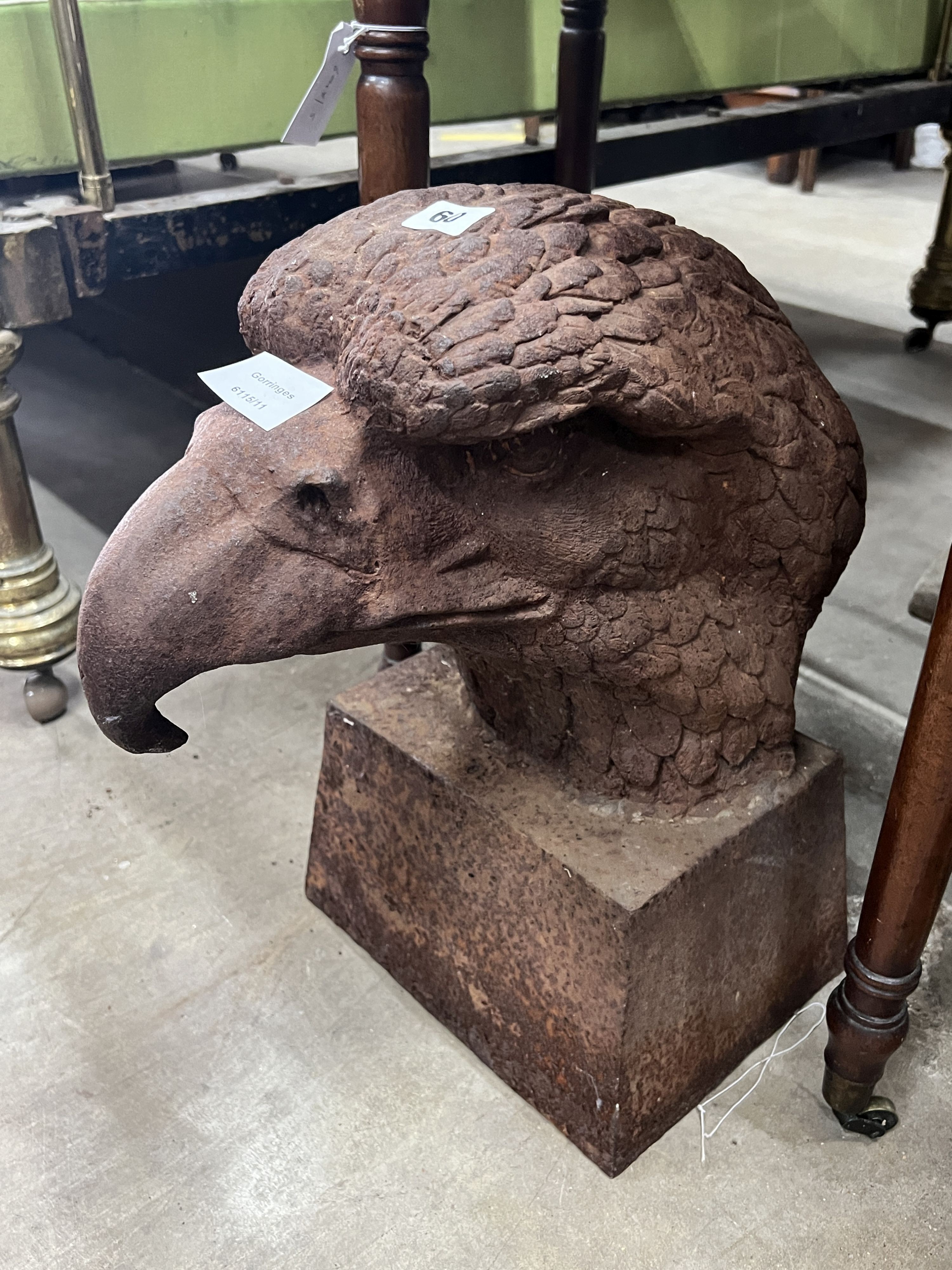 A large weathered cast iron eagle's head garden finial, height 44cm